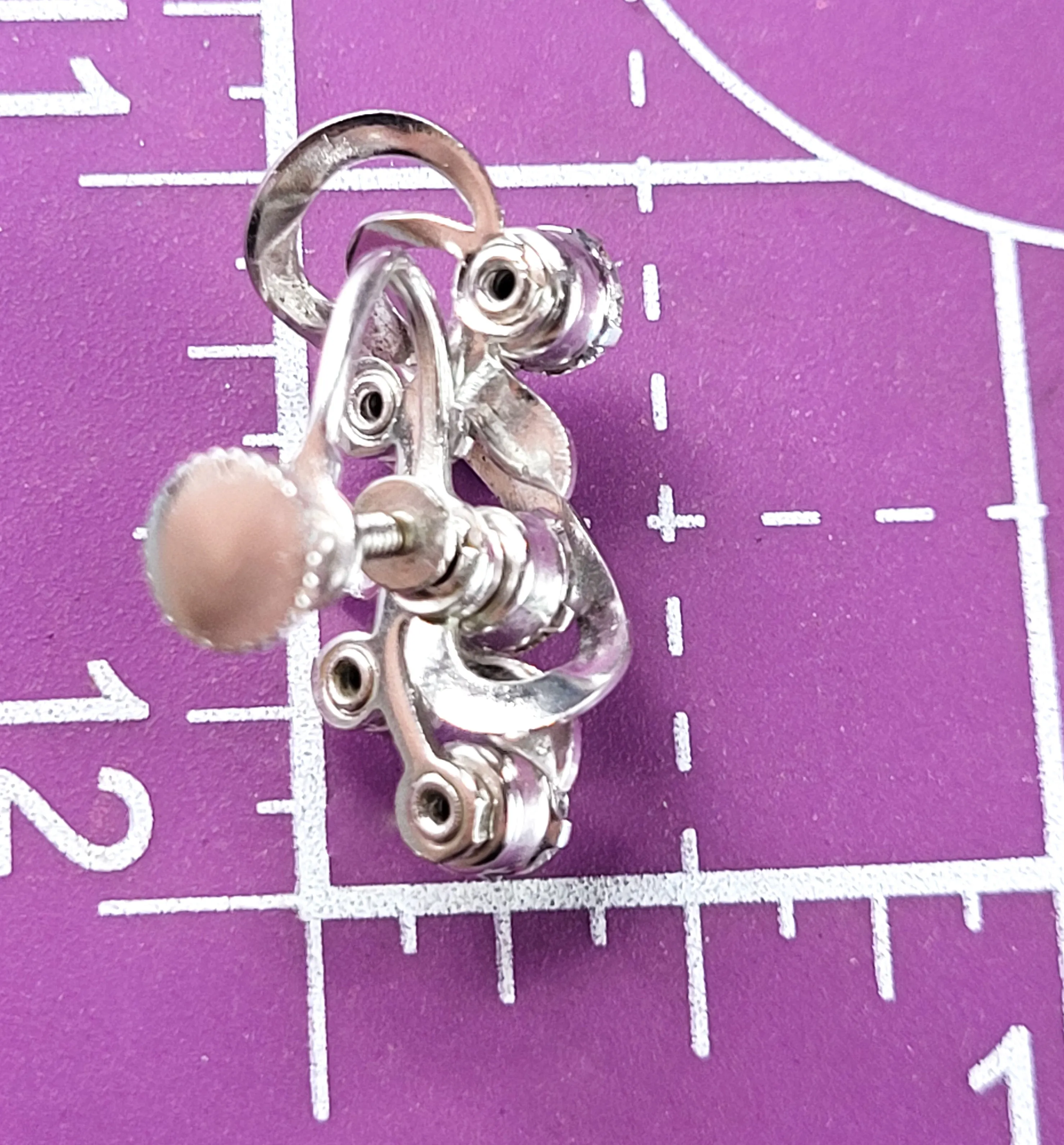 Clear rhinestone atomic swirl vintage clear mid century silver screw back earrings