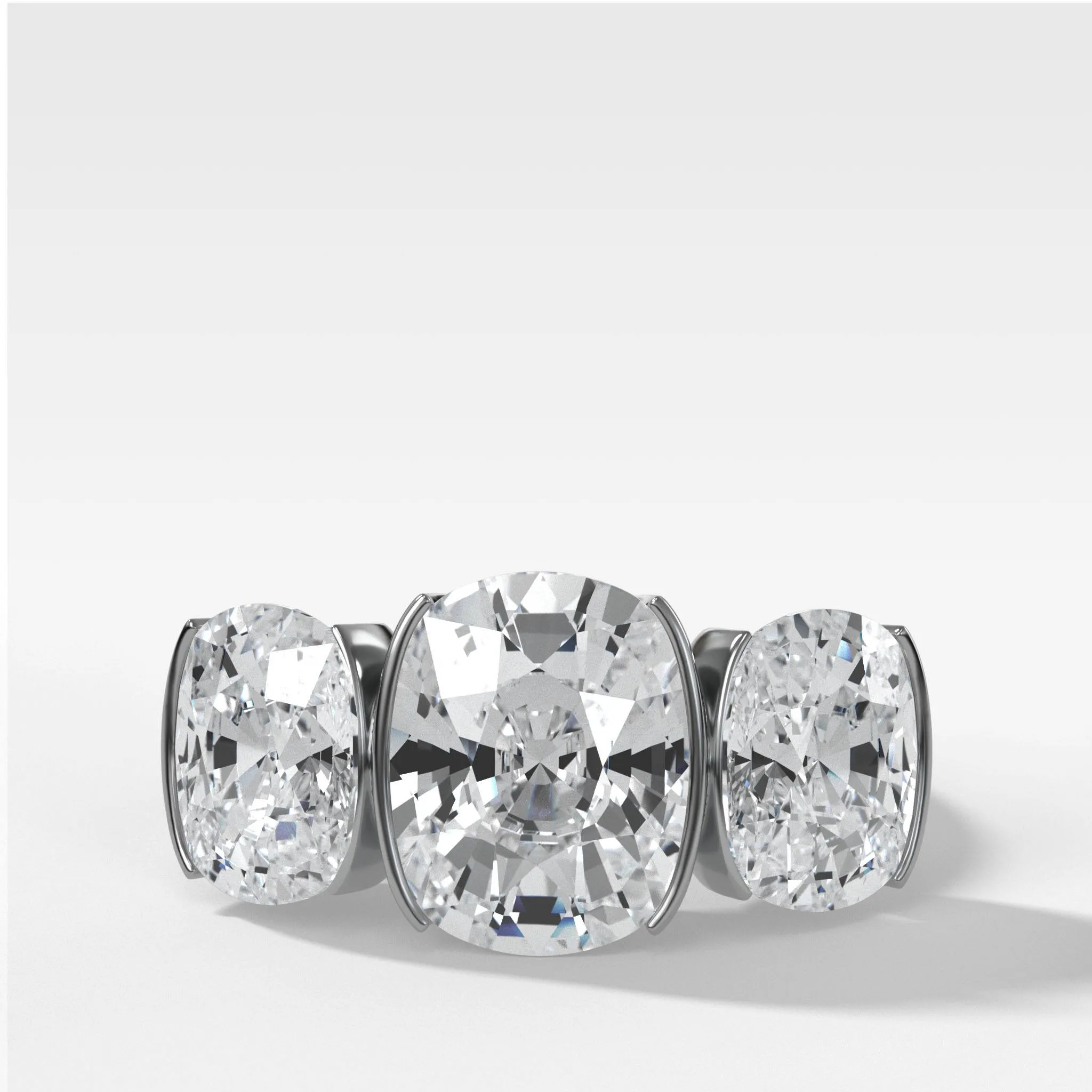 Half Bezel Triad Engagement Ring With Elongated Cushion Cut Diamonds