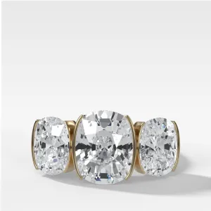 Half Bezel Triad Engagement Ring With Elongated Cushion Cut Diamonds