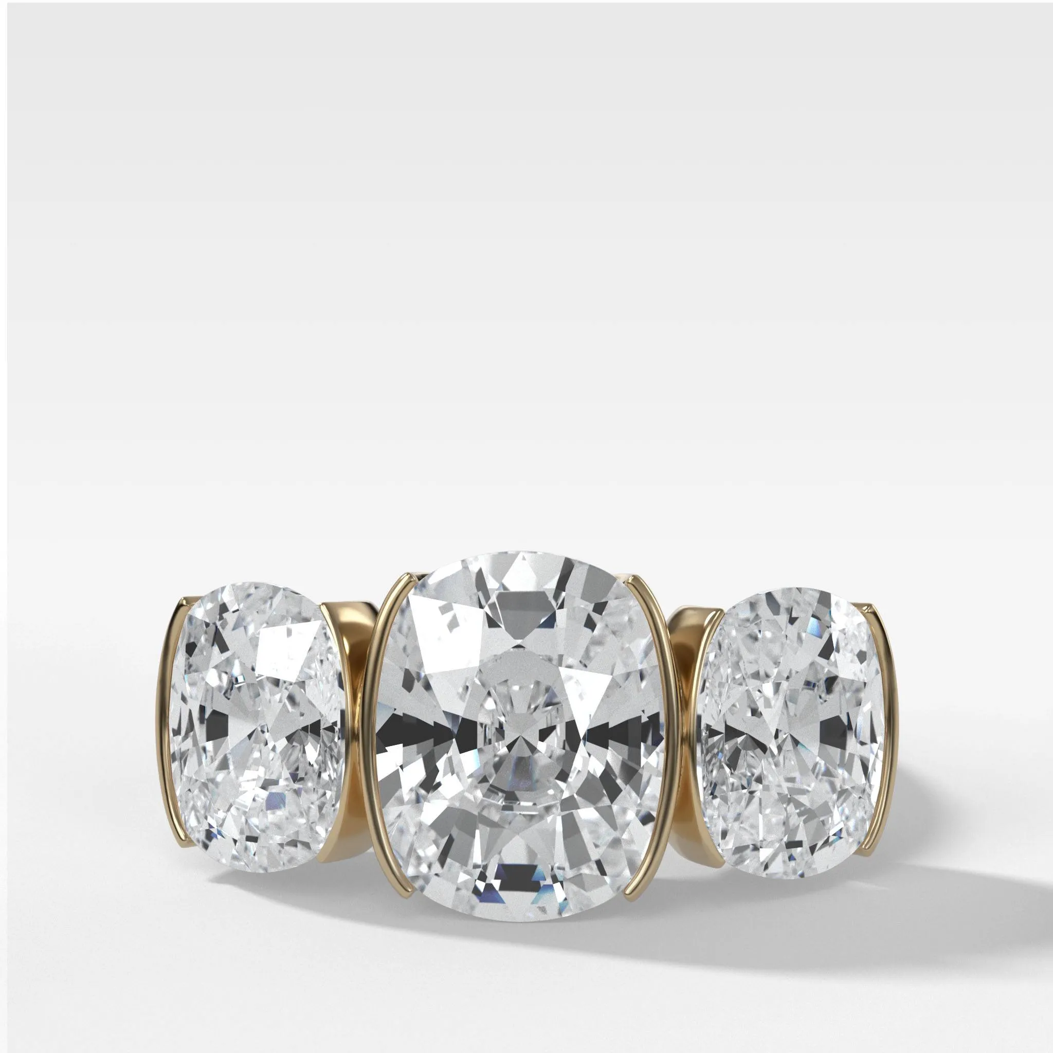 Half Bezel Triad Engagement Ring With Elongated Cushion Cut Diamonds