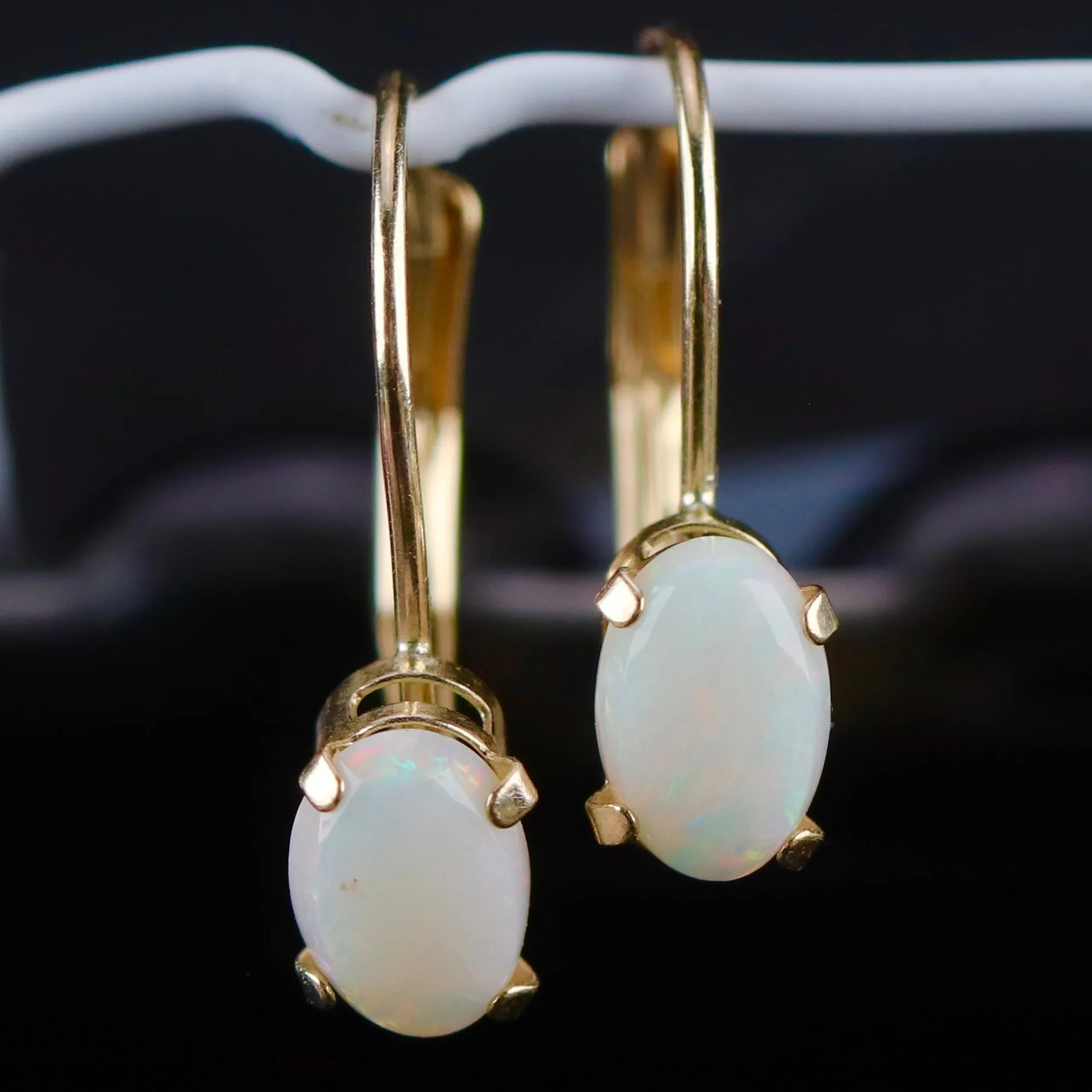 Opal leverback earrings in yellow gold