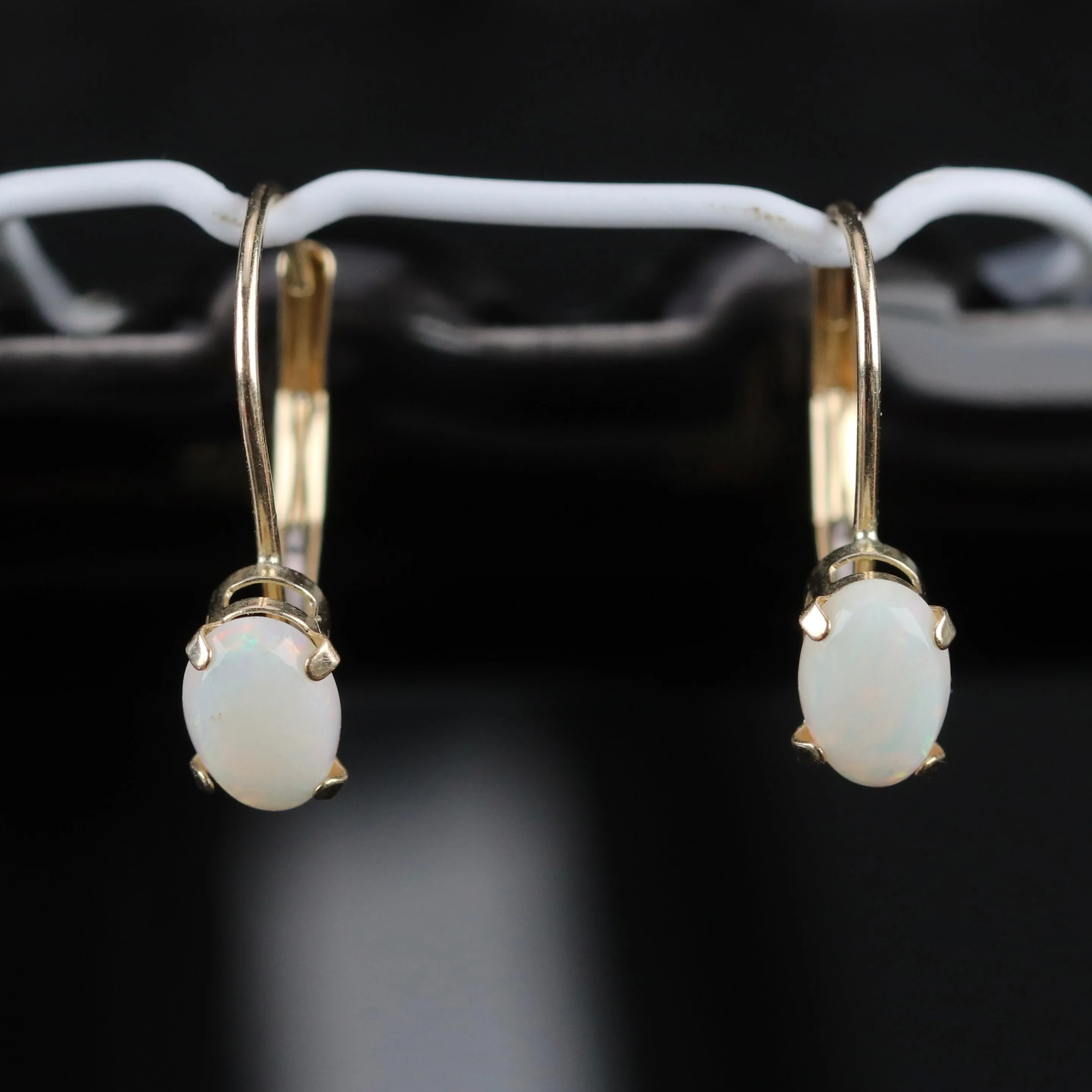 Opal leverback earrings in yellow gold