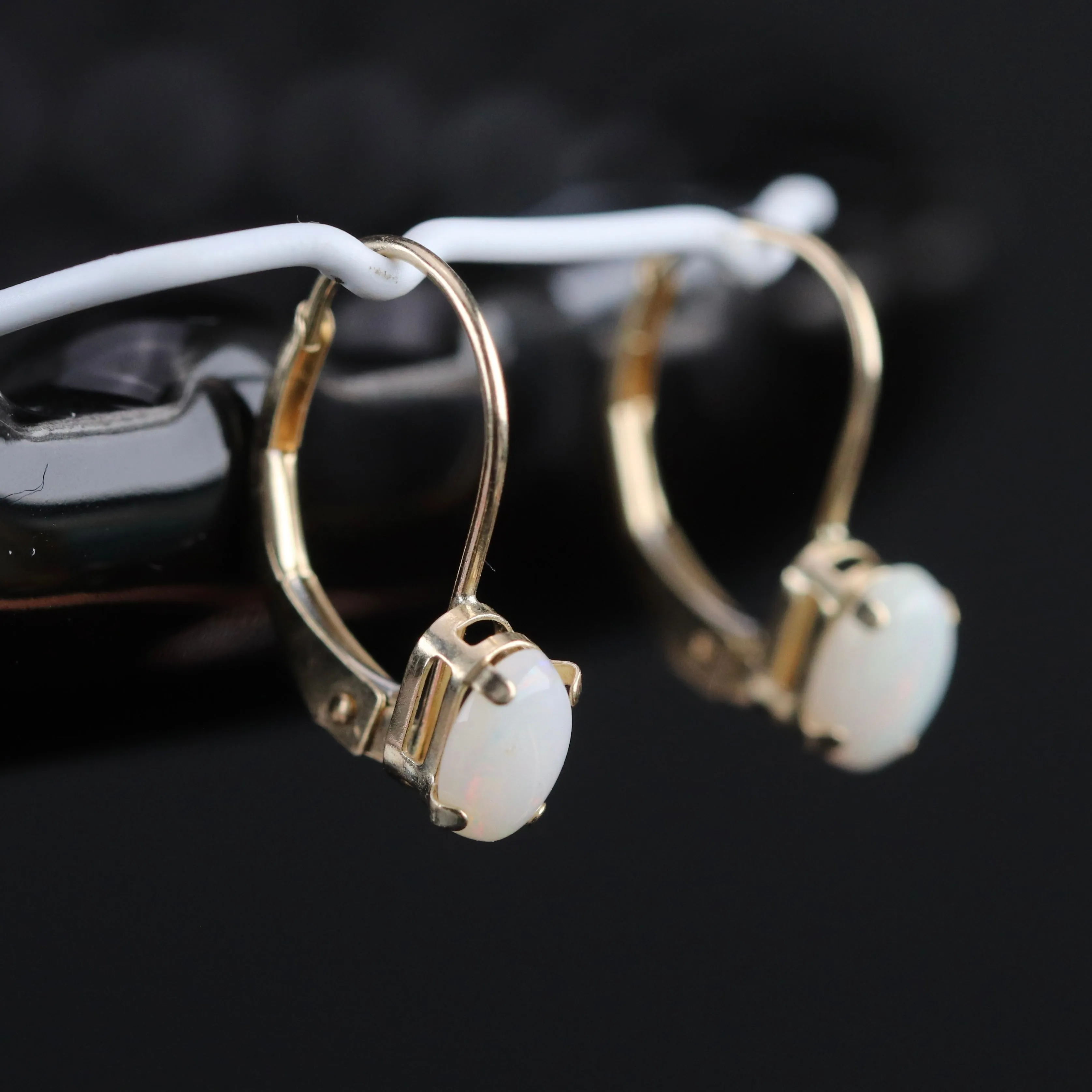 Opal leverback earrings in yellow gold