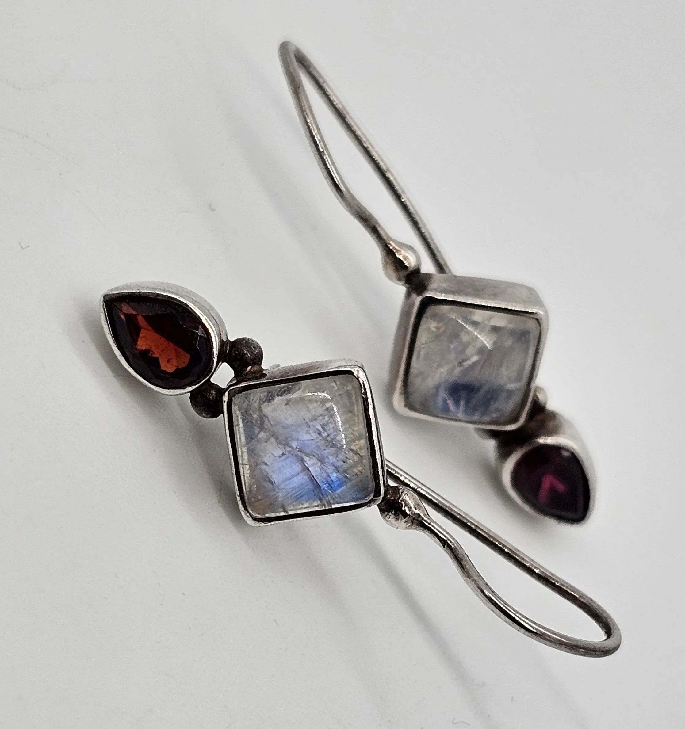 Princess cut blue flash moonstone and garnet tribal sterling silver earrings