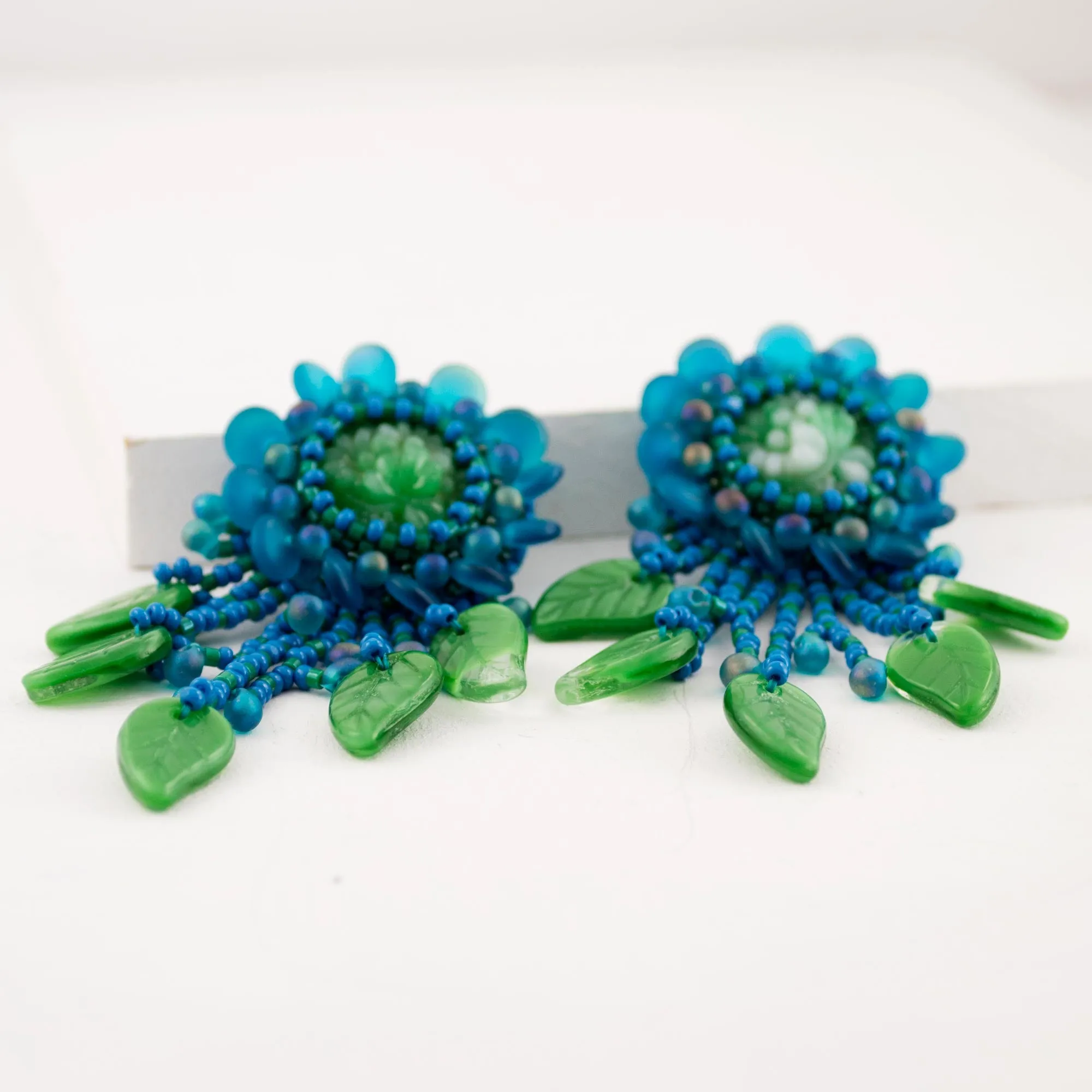 Teal green beaded statement earrings with vintage cabochon