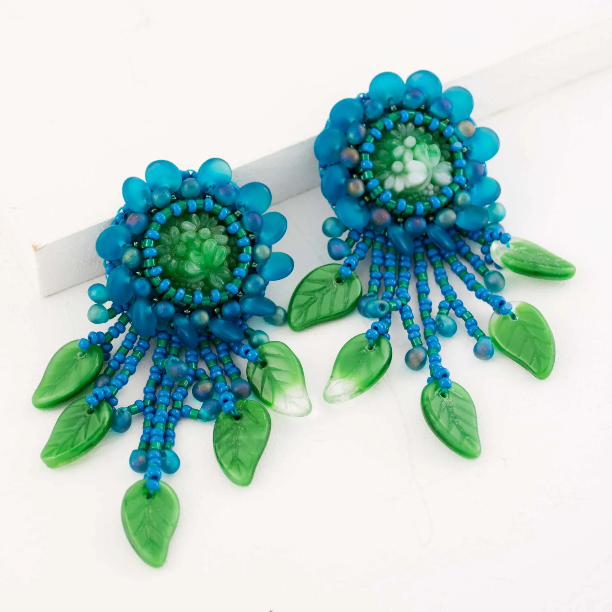 Teal green beaded statement earrings with vintage cabochon