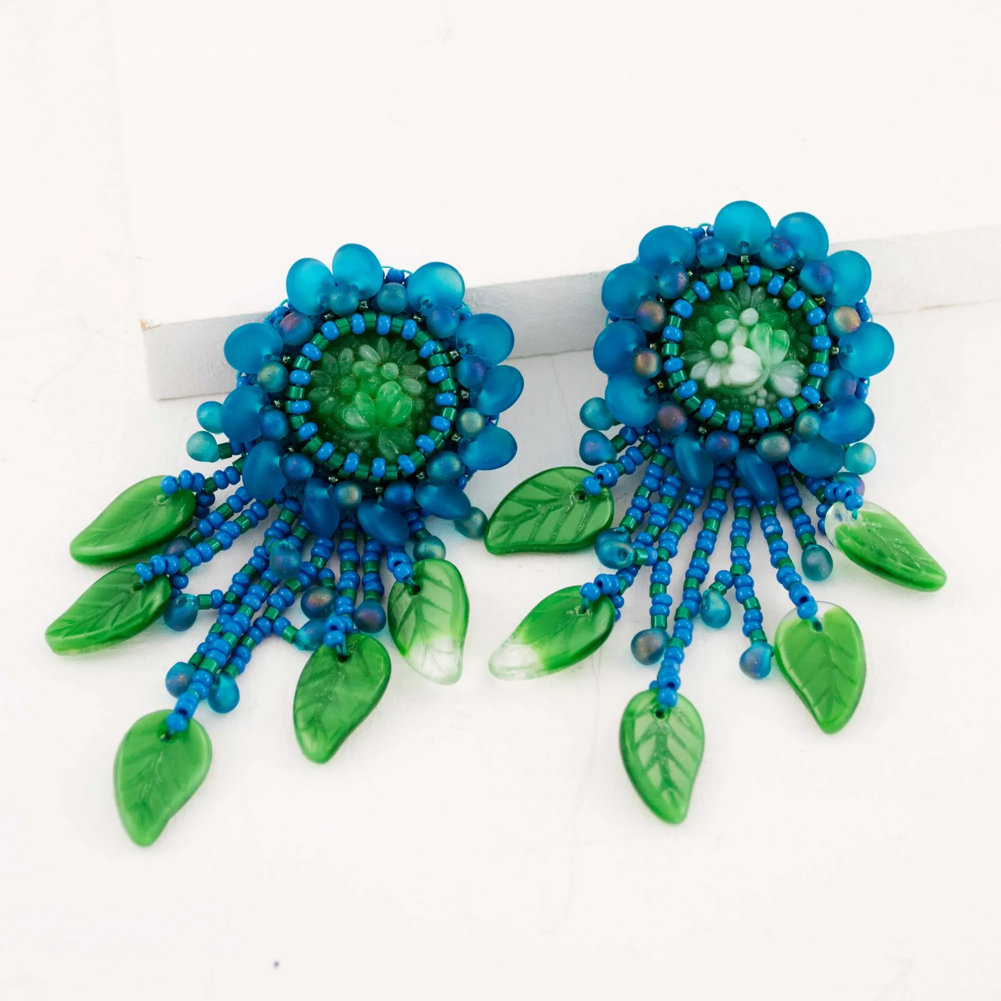 Teal green beaded statement earrings with vintage cabochon