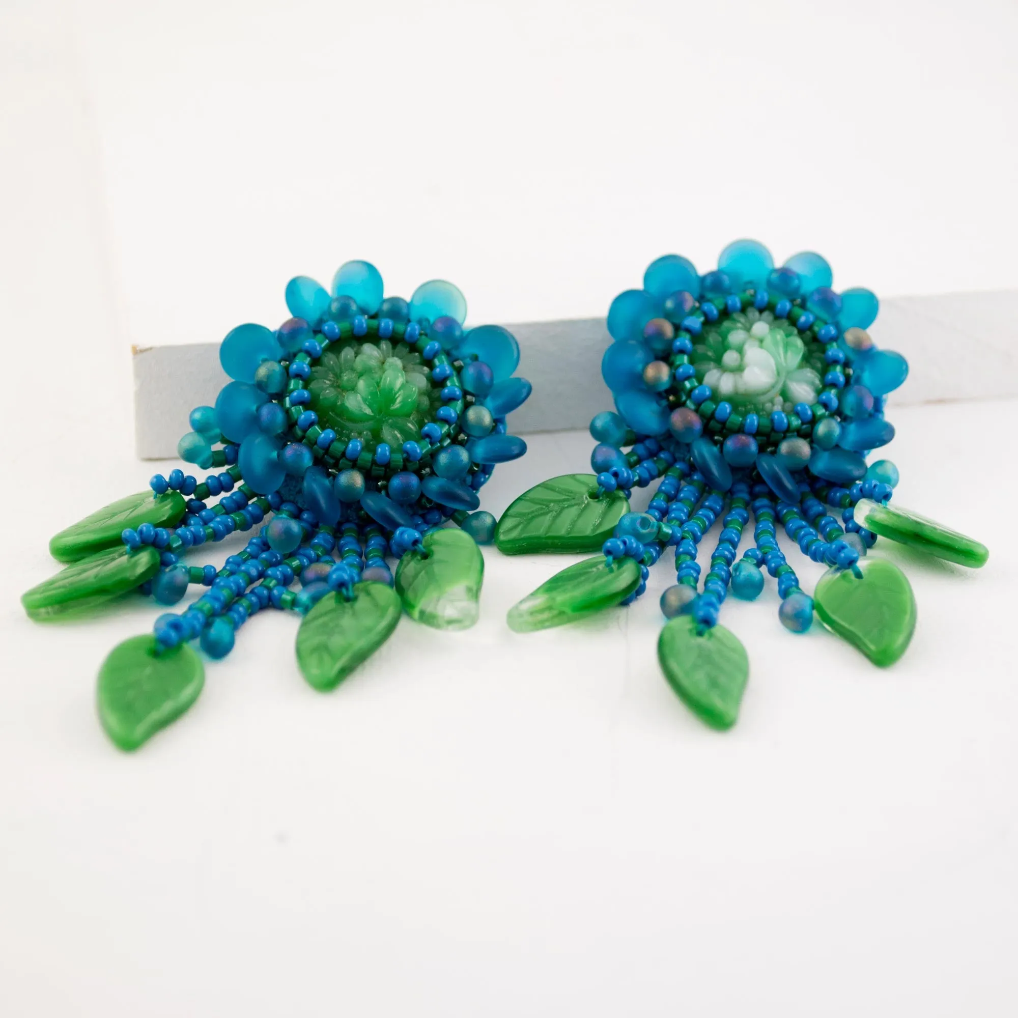 Teal green beaded statement earrings with vintage cabochon
