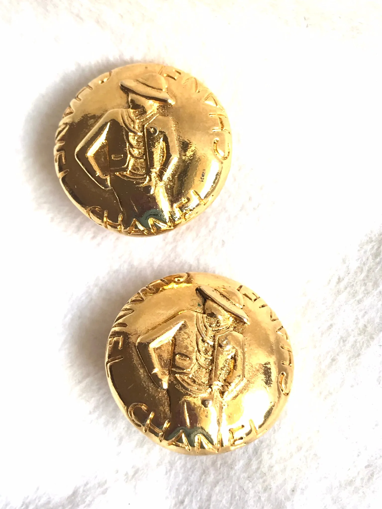 Vintage CHANEL gold tone round earrings with mademoiselle figure. Classic vintage Chanel jewelry. 0406011